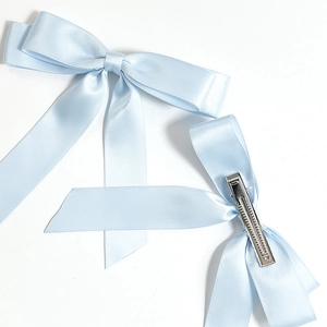 Elegant light blue satin bow hair clip with long ribbons and metal crocodile clip