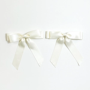 Elegant ivory satin bow hair clip with long streamers in a minimalist Korean style
