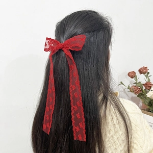 Elegant red lace bow hair clip with floral embroidery and long streamers for women