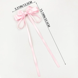 Pink satin ribbon bow hair clip with long tails and dimensions of 13.5cm width