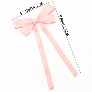 Pink satin bow hair clip detail with long ribbons showing dimensions 5.71 by 9.84 inches