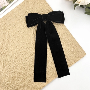 Elegant large black velvet bow hair clip with long ribbons for women's retro hairstyle