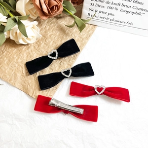 Set of four velvet bow hair clips in black and red with heart crystal embellishments