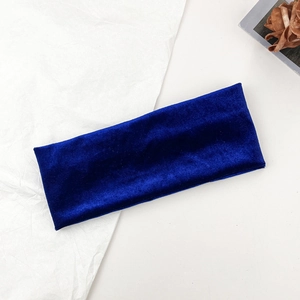 Detailed close-up of the navy blue velvet texture and stitching on the elastic headband