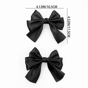 Set of two black satin bow hair clips with dimensions 10.5cm width and 11.5cm height
