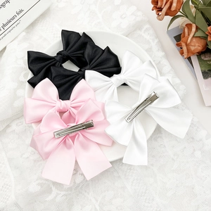 Satin bow hair clip set in black white and pink with metal crocodile clip