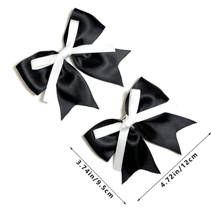 Minimalist black and white satin bow hair clips with layered ribbon design for women