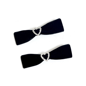 Pair of elegant black velvet bow hair clips with sparkling rhinestone heart accents