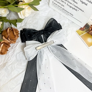 Elegant large mesh bow hair clips with silver rhinestones and long ribbons in black and white