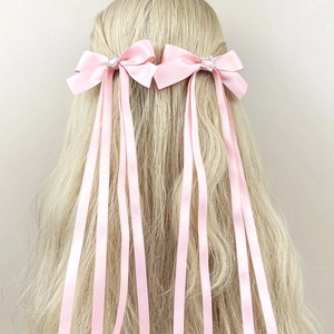 Barrettes nœuds en satin rose avec strass étoile argentée et longs rubans en soie