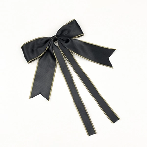 Pince à cheveux nœud satin noir avec bordure dorée scintillante et rubans longs pour femme