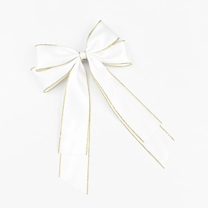 Elegant white satin hair bow with gold woven edges and long hanging ribbons