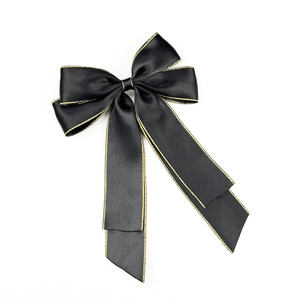 Elegant black satin bow hair clip with gold stitched edges and long silky ribbons