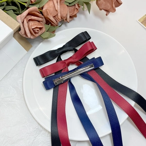 Elegant satin bow hair clips set with long ribbons in black, burgundy and navy colors