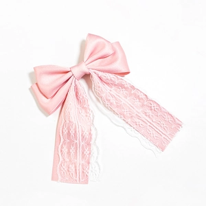 Elegant pink satin bow hair clip with white lace ribbons for a sweet vintage style