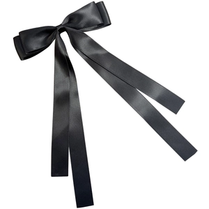 Elegant black satin bow hair clip with long ribbons and a silky finish on white background