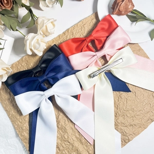 Set of satin ribbon bow hair clips in multiple colors for a vintage elegant look