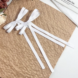 Pair of ballet-style white ribbon bow hair clips with long streamers for women