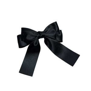 Elegant multi-layered black satin bow hair clip with polished fabric texture