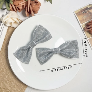 Sparkly silver glitter bow hair clips for women in vintage style and minimalist design