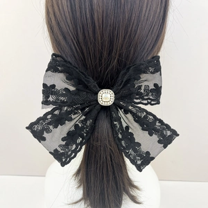 Elegant black lace bow hair clip with crystal and pearl detail for women's hairstyle