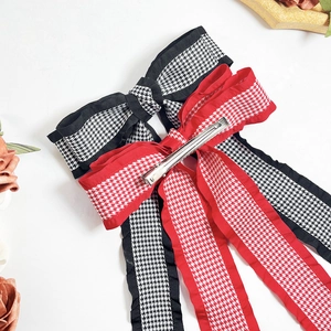 Houndstooth bow hair clips with long ribbons and ruffle edges in black and red colors