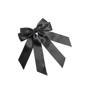 Elegant black satin bow hair clip with long ribbons and a silky glossy finish