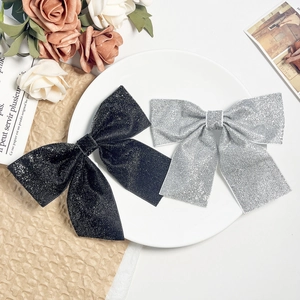 Sparkly sequin bow hair clips set in black and silver for elegant women hairstyles