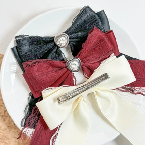 Set of three lace bow hair clips with heart gems in black, wine red, and beige colors