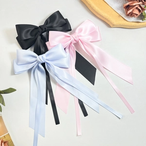 Elegant satin bow hair clips with long streamers in black, pink and light blue colors