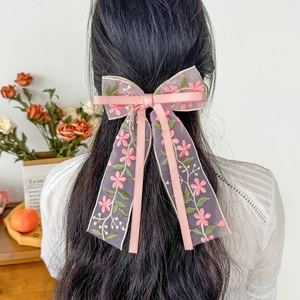 Pink embroidered flower bow hair clip with long ribbons for sweet spring hairstyles