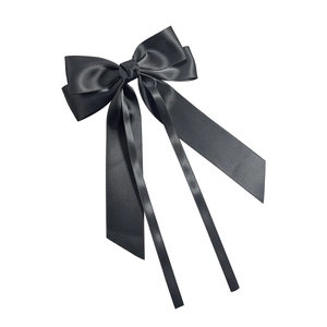 Elegant black satin bow hair clip with long ribbon streamers in minimalist Korean style
