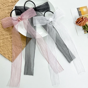 Three-piece set of mesh bow hair ties in black, pink, and white with long ribbon streamers