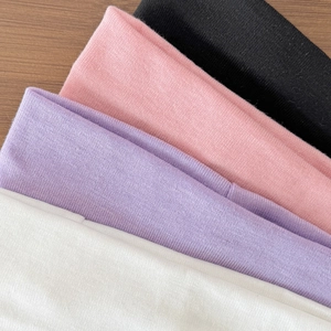 Pack of four elastic sport headbands in black, pink, purple, and white colors