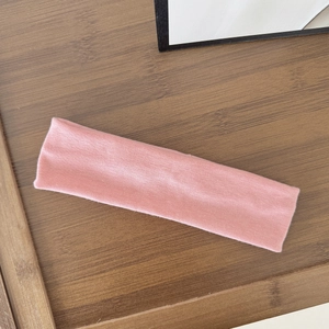 Pink elastic wide headband made of soft knitted fabric for yoga and fitness sports