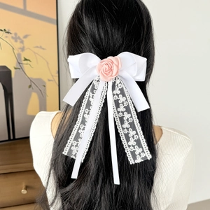 Elegant white lace bow hair clip with pink rose and long flowing floral embroidery ribbons