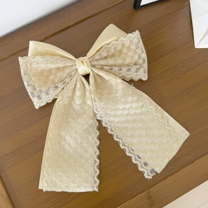 Elegant champagne lace bow hair clip with star embroidery on satin fabric for women