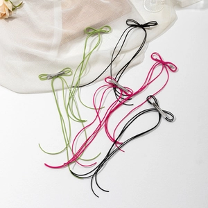 Barrettes à cheveux nœud style ballet avec de longs pompons en vert, noir et rose foncé