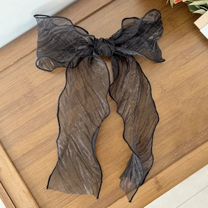 Elegant black mesh ribbon bow hair clip with long streamers for a fairy-inspired look