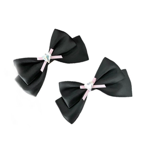 Paire de barrettes nœuds noirs avec cristaux cœur roses et rubans en satin doux
