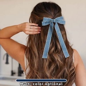 Blue denim bow hair clip with white embroidery edges and golden star accents for women