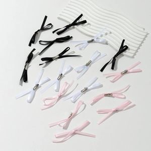 15-piece set of satin bow hair clips in black, white, and pink with metal duckbill clips