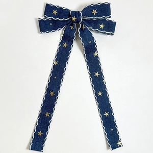 Vintage navy denim hair clip with lace trim, star embroidery and long bow ribbons