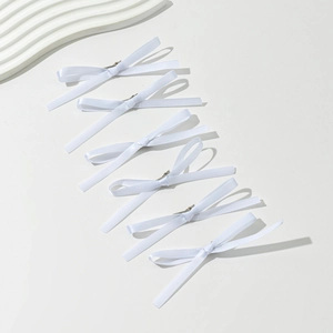 Set of six white satin ribbon hair bows with silver alligator clips for women