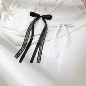Elegant bow hair clips with pearls and long tassels in black and white colors