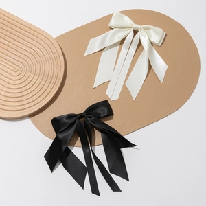 Elegant satin bow hair clip with long ribbons in cream white and classic black set