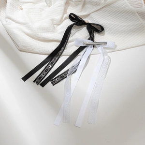 Elegant pair of pearl bow hair clips with long tassels in black and white lace style