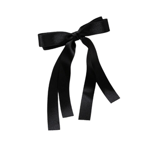Elegant black satin ribbon bow hair clip with long streamers on white background