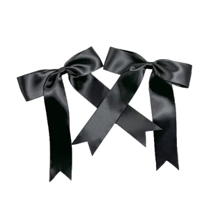 Elegant pair of black satin ballet-style bow hair clips with long ribbon streamers