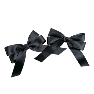 Pair of elegant French black satin bow hair clips with silky finish on white background